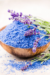 Obraz na płótnie Canvas Essential lavender salt with flowers top view.