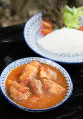 roasted pork with tomato sauce and rice