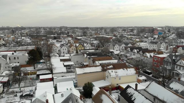 Urban Area Over Richmond Hill In Queens, New York. Snow Covers Crowded Houses And Streets.