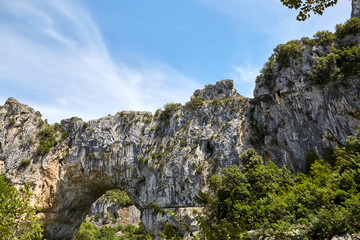 The Pont d'Arc is a natural stone arch in the Ardeche Gorges, France, Europe. Sunny summer day