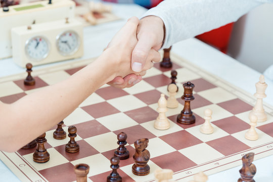 Handshake after Checkmate 