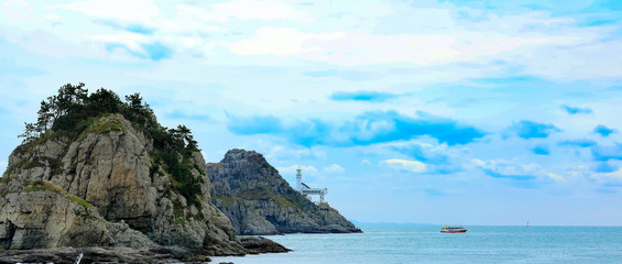 Oryukdo Islets with lighthouse and ferry boat for tourism transportation in Busan, South Korea