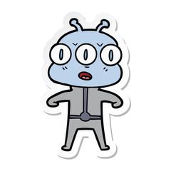 sticker of a cartoon three eyed alien