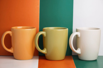 multi-colored ceramic cup on a colorful background