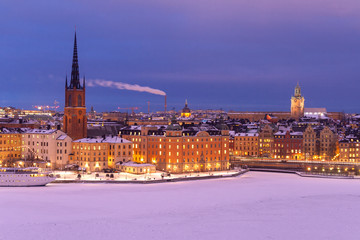 Snow on old building in winter Stockholm on sunset