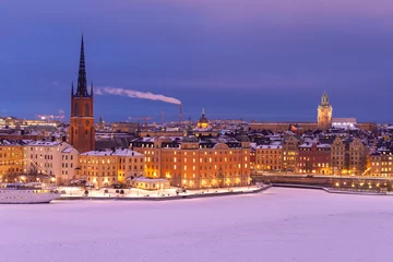 Foto op Canvas Snow on old building in winter Stockholm on sunset © tudumc