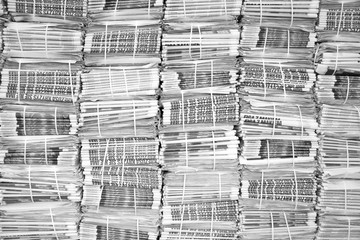 Stack of newspapers in black and white colors