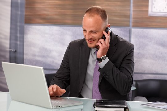 Portrait of busy businessman