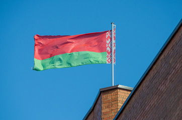 Belarusian flag against the blue sky