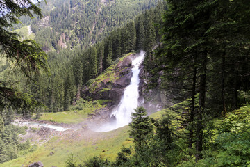 View from afar on one of the highest cascades of waterfalls in Europe - Krimmlsky waterfall in Austria