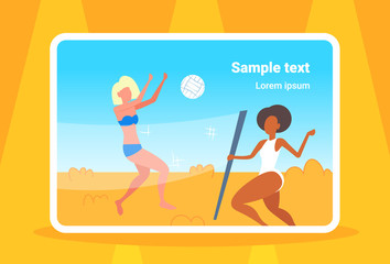 mix race women couple playing volleyball girls with volley ball having fun on sea beach active lifestyle summer vacation concept full length seaside horizontal copy space