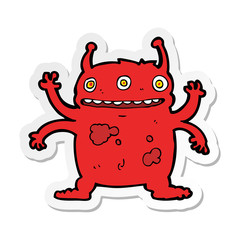 sticker of a cartoon alien monster