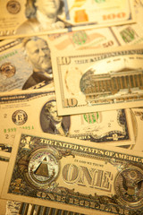 Currency US golden dollar banknotes close-up background.