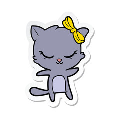 sticker of a cute cartoon cat with bow