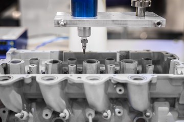 Automated robotic drill working in industrial factory