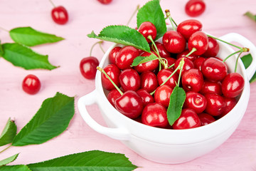 Ripe cherry berries and cherry leaf colourful bright pattern
