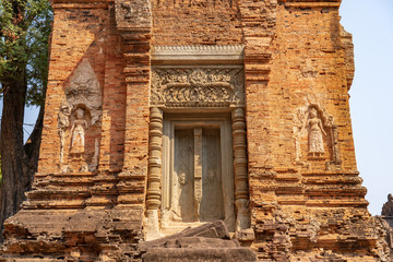 Fototapeta na wymiar Secondary tower of Bakong temple, Cambodia. False decorative door