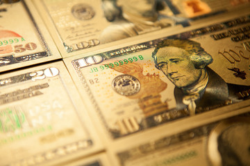 Currency US golden dollar banknotes close-up background.