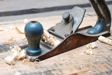 metal planer for wood with blue pen, around planer shavings, old homemade tool