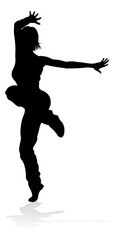 A woman street dance hip hop dancer in silhouette