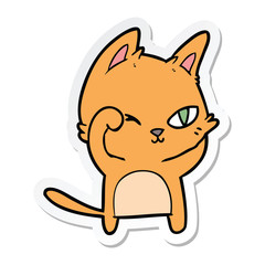 sticker of a cartoon cat rubbing eye