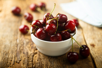 Fresh cherry in the white bowl