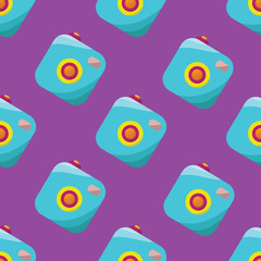 Vector seamless pattern made of vintage film camera on violet background.
