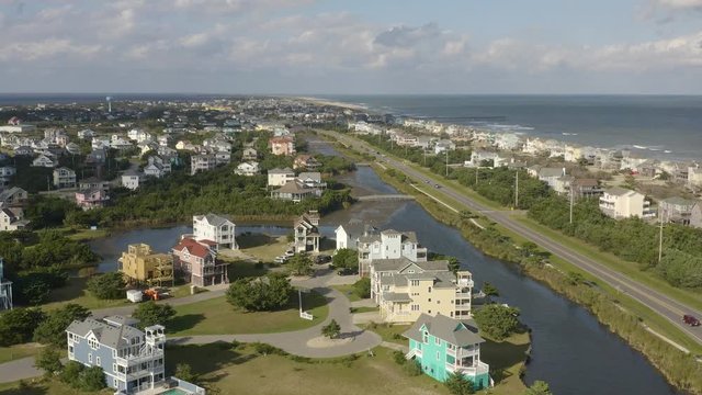 136 Aerial view of fancy houses, flying above town and beach. 4k