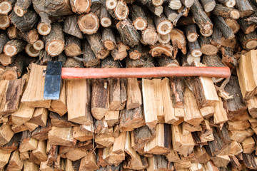 cleaver on the bunch of chopped firewoods