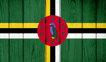 Flag of Dominica on wooden background