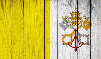 Flag of Vatican on wooden background
