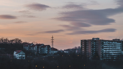 Fototapeta premium Sunset sky above the city buildings