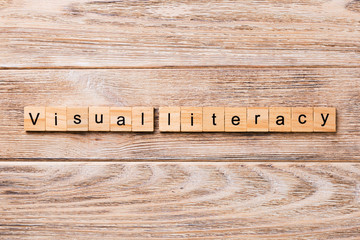 visual literacy word written on wood block. visual literacy text on wooden table for your desing, concept