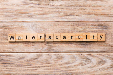 Water scarcity word written on wood block. Water scarcity text on wooden table for your desing, concept