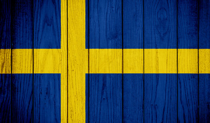 Flag of Sweden on wooden background