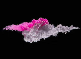 Coloured acrylic ink mixing in water on black