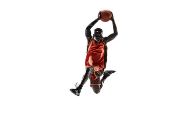 Naklejka na ściany i meble Full length portrait of a basketball player with a ball isolated on white studio background. advertising concept. Fit african american athlete jumping with ball. Motion, activity, movement concepts.