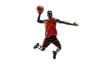 Full length portrait of a basketball player with a ball isolated on white studio background....