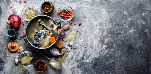 Fish soup in metal pan