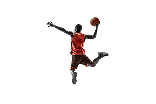 Full Length Portrait Of A Basketball Player With A Ball Isolated On White Studio Background. Advertising Concept. Fit African American Athlete Jumping With Ball. Motion, Activity, Movement Concepts.