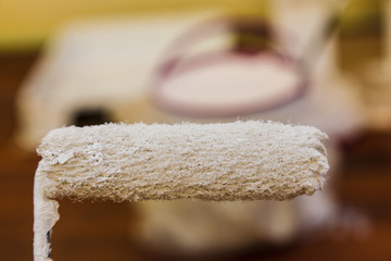 White paint on roller brush