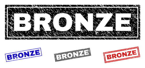 Grunge BRONZE rectangle stamp seals isolated on a white background. Rectangular seals with distress texture in red, blue, black and grey colors.