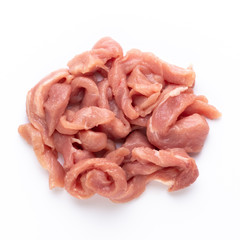 Raw chicken fillet. Small pieces of meat isolated on white.