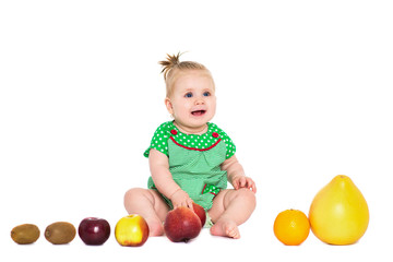 Fototapeta na wymiar Baby girl sitting with fruits and vegetables, isolated over white