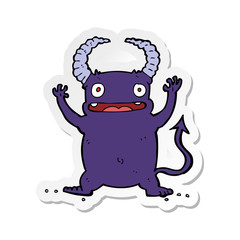 sticker of a cartoon little devil