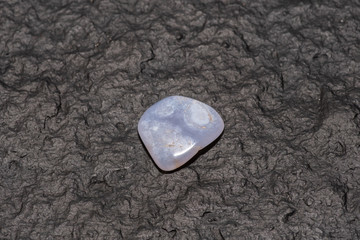 Macro shooting of natural gemstone. Mineral blue agate