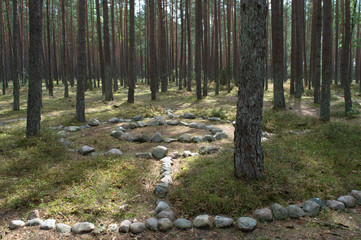Cromlêh in stone circle, gothic tomb, Poland
