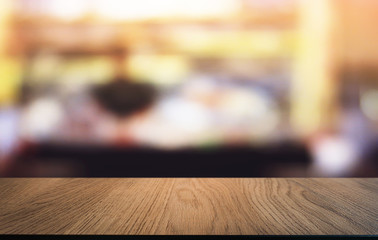 Empty dark wooden table in front of abstract blurred bokeh background of restaurant . can be used for display or montage your products.Mock up for space.