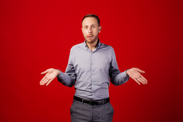 man with confused. emotions, facial expressions, feelings, body language, signs. image on a red...