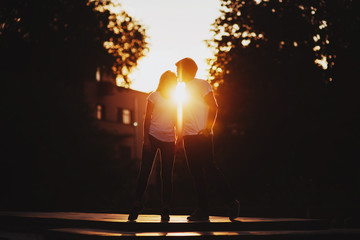 Couple in love enjoying moments during sunset outdoors